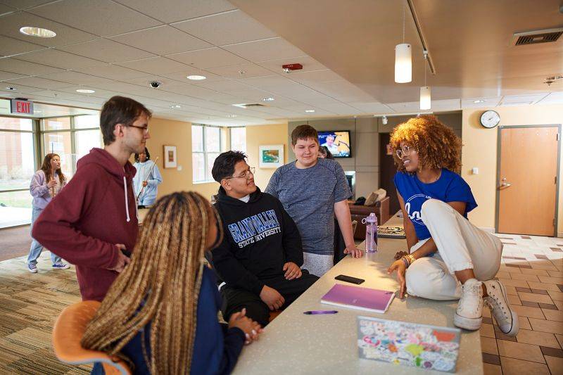 GVSU students in a housing lounge.